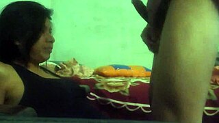 The student kneels for an oral exam, eagerly sucking the teacher's cock in the classroom