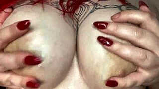 Sexy BBW massaging her big natural tits with slick oil