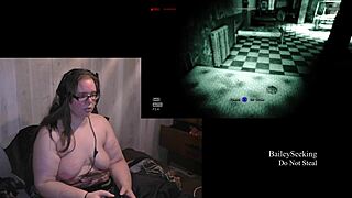 Naked brunette plays Outlast with natural tits in part 3