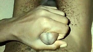 gay twink stroking his big hairy cock at home