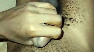 gay twink stroking his big hairy cock at home