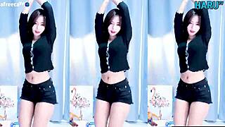 Korean girl performs a cute and sexy dance routine.