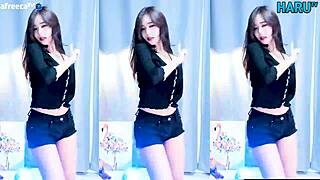 Korean girl performs a cute and sexy dance routine.