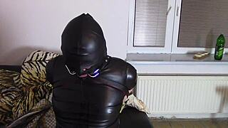 Katja the crossdresser in leather bondage and drooling