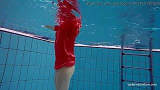Avenna’s naked body glides through the water in the pool