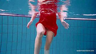 Avenna’s naked body glides through the water in the pool