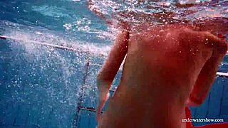 Avenna’s naked body glides through the water in the pool