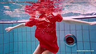 Avenna’s naked body glides through the water in the pool