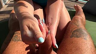 hot babe delivers a quick sloppy handjob on ocean terrace, risking it all