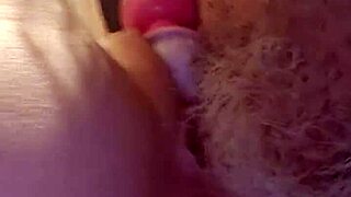 A video of a shaved pussy squirting is here