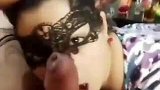 Watch her give a masked deepthroat blowjob.