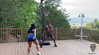 Basketball game heats up as Rome Major drills Monica Santhiago with deep thrusts.