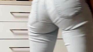 Petite blonde in tight jeans shows her cooleyhoppers in a homemade video