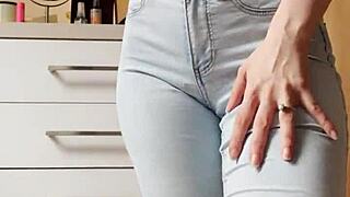 Petite blonde in tight jeans shows her cooleyhoppers in a homemade video