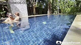 A girl took a swim and her partner joined her in the pool