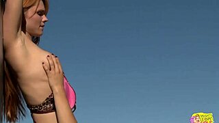 brunette and blonde lesbians enjoy outdoor fun.