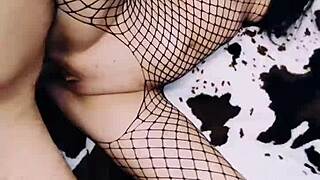 A wife in fishnet bodysuit poses beautifully