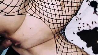 A wife in fishnet bodysuit poses beautifully