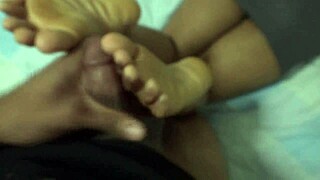 Neighbor's secret footjob session with cum