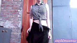 undressing clothes ripped striptease in casual home setting.