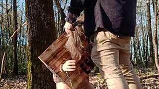 in 2025, the female slave is bound in the pillory, flashing her tits and getting a blowjob with cum in mouth