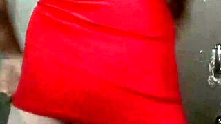 trans woman in a dress showing off her curves