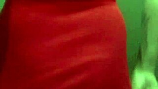 trans woman in a dress showing off her curves