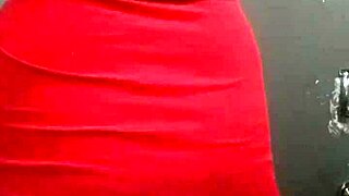 trans woman in a dress showing off her curves