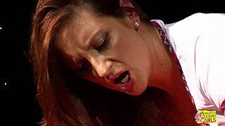This brunette with huge breasts got drilled hard by a blonde lesbian using a strapon