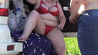 Mature lesbians flash big asses outdoors in lingerie. Voyeur watches with hidden camera in public park fetish scene.