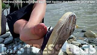 goddess in tan nylons shows her cute nylon soles and toes on the riverside