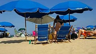 candid on this little 18+ slut at the beach in bikini