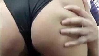 Undressing Doña Mary in her room as her husband leaves.