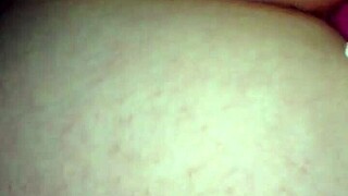 Exploring intimate moments with a partner using toys.