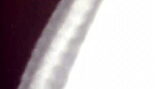 Exploring intimate moments with a partner using toys.