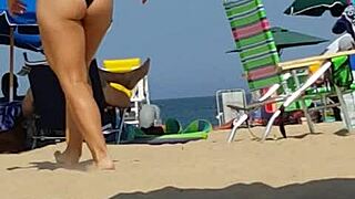 candid on this little 18+ slut at the beach in bikini