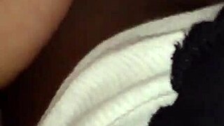 Exploring intimate moments with a partner using toys.