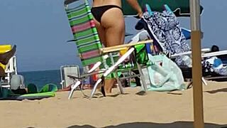 candid on this little 18+ slut at the beach in bikini