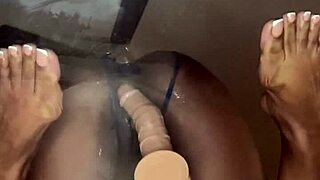 Ebony rides dildo deep in pussy during double penetration masturbation