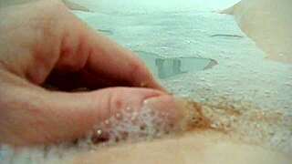 Annie bathes her big tits in the tub