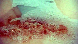 Annie bathes her big tits in the tub