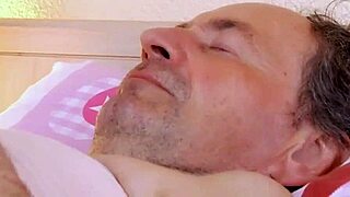 Gentle French Nurse Cares For Elderly Patient In Hospital Ward