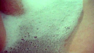 Annie bathes her big tits in the tub