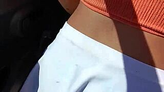 Check out the prostitute flashing her tattooed ass outdoors