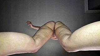 Hot tattooed babe dances nude seductively.