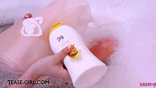 Enchanting brunette muse relaxes in sensual bath