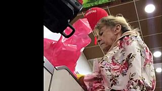 I spy on the hot granny in her skirt at the shop, upskirt view