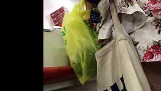 I spy on the hot granny in her skirt at the shop, upskirt view