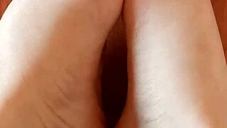 greta puts nail polish on her toenails