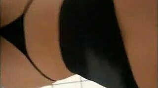 latina amateur poses in front of mirror